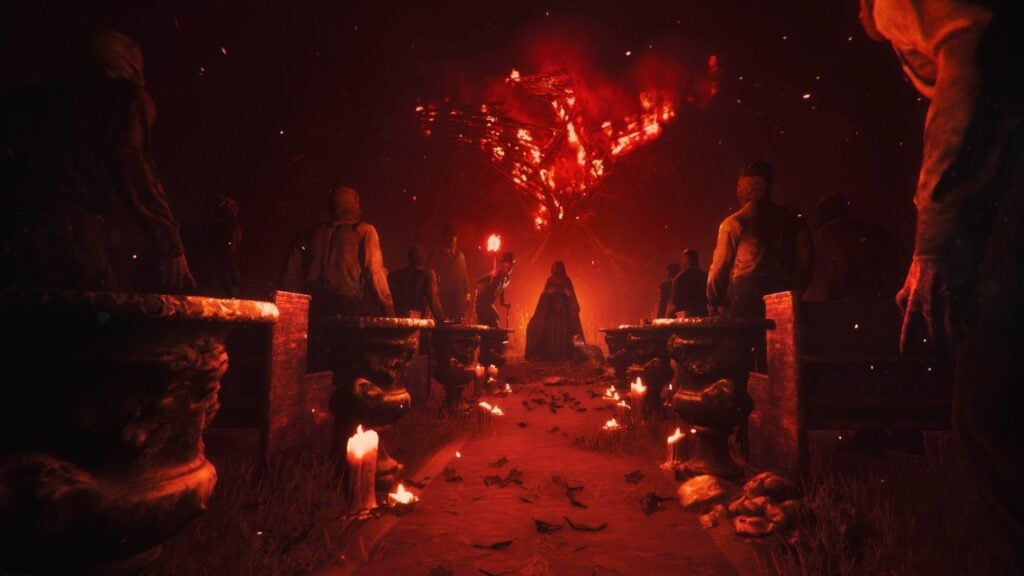 A screenshot from Maid Of Sker, showing a group of cultists facing a flaming bird effigy.